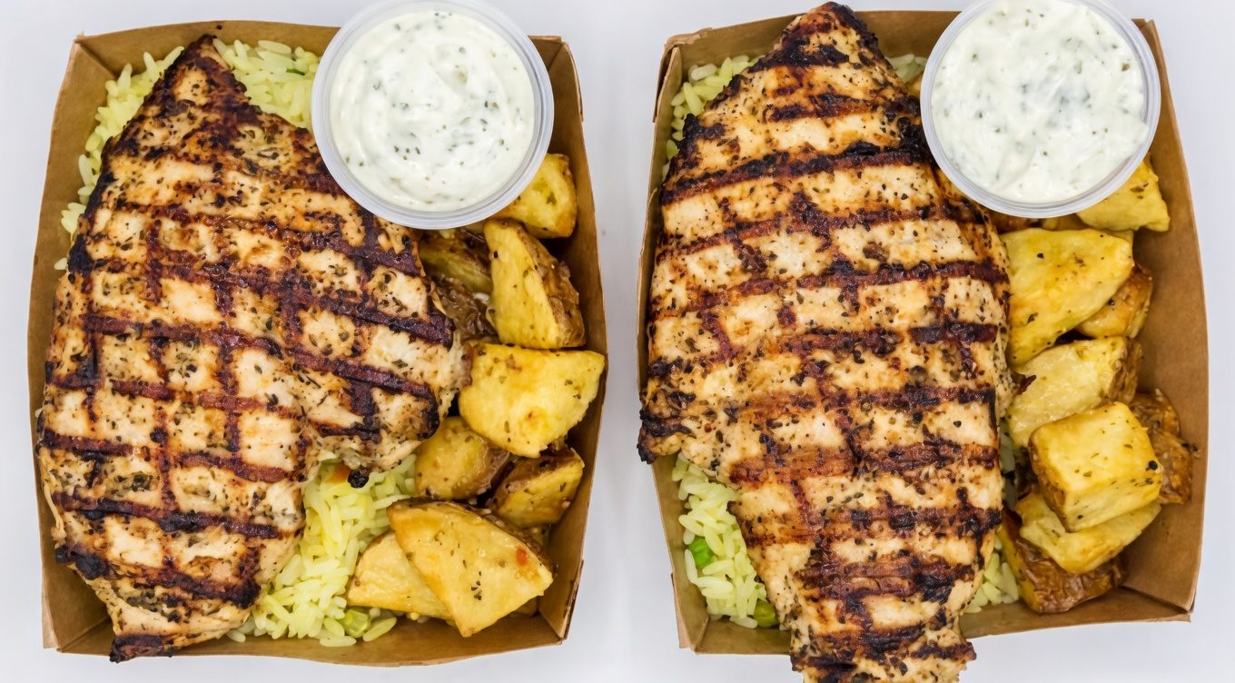 Meal for two with grilled chicken breasts, potatoes and rice